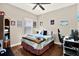Bedroom with hardwood floors, a ceiling fan, and a work from home space at 406 Laguna Mill Dr, Ruskin, FL 33570