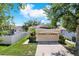 Charming single-Gathering home with a well-maintained lawn and a two-car garage at 406 Laguna Mill Dr, Ruskin, FL 33570
