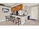 Eat-in kitchen boasts granite countertops, stainless appliances, and counter seating at 406 Laguna Mill Dr, Ruskin, FL 33570