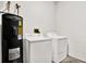 Laundry room equipped with a washer, dryer, and water heater at 406 Laguna Mill Dr, Ruskin, FL 33570
