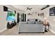 Comfortable living room with tile floor, a large grey sectional, and sliding glass doors at 406 Laguna Mill Dr, Ruskin, FL 33570