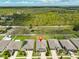 Aerial view shows the property situated next to a green space, offering privacy and a natural setting at 4485 Eternal Prince Dr, Sun City Center, FL 33573