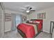 Serene bedroom with modern decor, soft carpet, a ceiling fan, and stylish window treatments at 4485 Eternal Prince Dr, Sun City Center, FL 33573