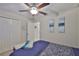Relaxing bedroom features a ceiling fan, closet, plush carpeting, and neutral tones creating a calm retreat at 4485 Eternal Prince Dr, Sun City Center, FL 33573