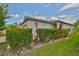 Beautiful home exterior featuring well-maintained landscaping, and lush green hedges at 4485 Eternal Prince Dr, Sun City Center, FL 33573