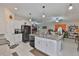 Open-concept kitchen featuring stainless steel appliances and barstool seating at 4485 Eternal Prince Dr, Sun City Center, FL 33573