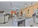 Open-concept kitchen featuring granite countertops and stainless steel appliances at 4485 Eternal Prince Dr, Sun City Center, FL 33573