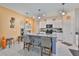 Spacious kitchen featuring granite countertops, stainless steel appliances, and a kitchen island at 4485 Eternal Prince Dr, Sun City Center, FL 33573