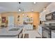 Modern kitchen featuring granite countertops, stainless steel appliances, and ample cabinet space at 4485 Eternal Prince Dr, Sun City Center, FL 33573