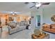 Inviting living space featuring neutral tones, tile floors, and an open layout to the kitchen area at 4485 Eternal Prince Dr, Sun City Center, FL 33573