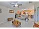 Bright living room boasts tile floors, neutral decor, and a comfortable seating arrangement at 4485 Eternal Prince Dr, Sun City Center, FL 33573
