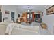 Spacious living area featuring tile floors, neutral walls, and a view into an adjacent living space at 4485 Eternal Prince Dr, Sun City Center, FL 33573