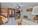 Comfortable living room with a fireplace, tile floors, and natural light from the windows at 4485 Eternal Prince Dr, Sun City Center, FL 33573