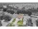 Aerial view of a single-Gathering home featuring a well-manicured lawn and an attached two-car garage at 518 Winthrop Dr, Spring Hill, FL 34609