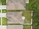 Birds-eye view of a home with a fenced-in yard and patio area, offering privacy and outdoor space at 518 Winthrop Dr, Spring Hill, FL 34609