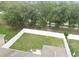 Aerial view of a fenced backyard with a well-maintained lawn, ideal for outdoor activities and relaxation at 518 Winthrop Dr, Spring Hill, FL 34609