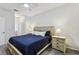 Cozy bedroom featuring a ceiling fan, neutral walls, and a bed with nightstands at 518 Winthrop Dr, Spring Hill, FL 34609
