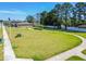Aerial view of a community park with walking paths, green space, and mature trees at 518 Winthrop Dr, Spring Hill, FL 34609