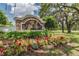 Landscaped entrance sign for Villages of Avalon, surrounded by colorful flowers and lush greenery at 518 Winthrop Dr, Spring Hill, FL 34609