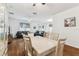 Open-concept dining area with wood floors, neutral colors, and lots of natural light at 518 Winthrop Dr, Spring Hill, FL 34609