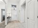 Bright entryway featuring tile floors, an entry door, and a decorative table at 518 Winthrop Dr, Spring Hill, FL 34609
