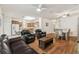Spacious living area showcasing hardwood floors, an open layout, and a comfortable seating arrangement at 518 Winthrop Dr, Spring Hill, FL 34609