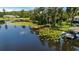 Scenic aerial view of the lakefront property with a private dock and lush surroundings at 523 2Nd Sw Ave, Lutz, FL 33548