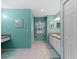 Bathroom featuring a vanity with double sinks, natural light, and tile flooring at 523 2Nd Sw Ave, Lutz, FL 33548