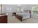 Bedroom featuring natural light, carpeted floors, furniture, and calming decor at 523 2Nd Sw Ave, Lutz, FL 33548