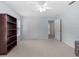 This is a bedroom with light blue walls, carpeted floors, and a ceiling fan at 523 2Nd Sw Ave, Lutz, FL 33548