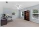 Office/bedroom with ample natural light, desk, shelves, and carpet at 523 2Nd Sw Ave, Lutz, FL 33548