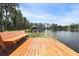 Private dock on the lake with seating and ladder access, perfect for enjoying the waterfront at 523 2Nd Sw Ave, Lutz, FL 33548