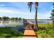 Scenic view of a wooden dock extending into a calm lake at 523 2Nd Sw Ave, Lutz, FL 33548