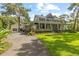 Inviting two-story home with a charming front porch and manicured lawn at 523 2Nd Sw Ave, Lutz, FL 33548