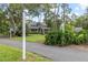 Charming two-story home surrounded by mature trees and lush landscaping at 523 2Nd Sw Ave, Lutz, FL 33548