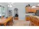 Bright kitchen and breakfast nook features light wood cabinets, tile floors and countertops at 523 2Nd Sw Ave, Lutz, FL 33548