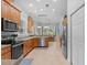 Spacious kitchen with stainless steel appliances and a dining area with a large window at 523 2Nd Sw Ave, Lutz, FL 33548