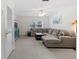 Upstairs living room with a large sectional sofa and a view of the outdoors at 523 2Nd Sw Ave, Lutz, FL 33548