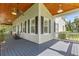 Spacious covered porch with a wood ceiling, ideal for relaxing outdoors at 523 2Nd Sw Ave, Lutz, FL 33548
