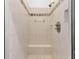 Clean shower with tiled walls, a built-in seat, and a mounted shower head at 523 2Nd Sw Ave, Lutz, FL 33548