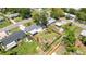 Aerial view showcases large backyard with shed and fenced in yard at 5514 7Th N Ave, St Petersburg, FL 33710