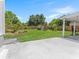 Spacious backyard with a large lawn, shed, and wooden fence at 5514 7Th N Ave, St Petersburg, FL 33710