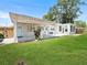 Spacious backyard with a covered patio and sunroom, perfect for outdoor entertaining at 5514 7Th N Ave, St Petersburg, FL 33710