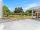 Expansive backyard features lush lawn, shed and a wooden fence at 5514 7Th N Ave, St Petersburg, FL 33710
