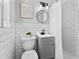 Bathroom featuring black fixtures, tiled walls, and shower at 5514 7Th N Ave, St Petersburg, FL 33710
