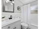 Updated bathroom with white tile, vanity, and modern fixtures at 5514 7Th N Ave, St Petersburg, FL 33710