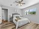 Bedroom featuring a large window, ceiling fan, and closet at 5514 7Th N Ave, St Petersburg, FL 33710