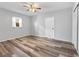 This is a bedroom featuring wood laminate floors, and ceiling fan at 5514 7Th N Ave, St Petersburg, FL 33710