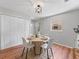 The dining room offers a round table and stylish lighting at 5514 7Th N Ave, St Petersburg, FL 33710