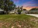 Charming single-story home with a well-manicured lawn, palm trees and delightful curb appeal at 5514 7Th N Ave, St Petersburg, FL 33710